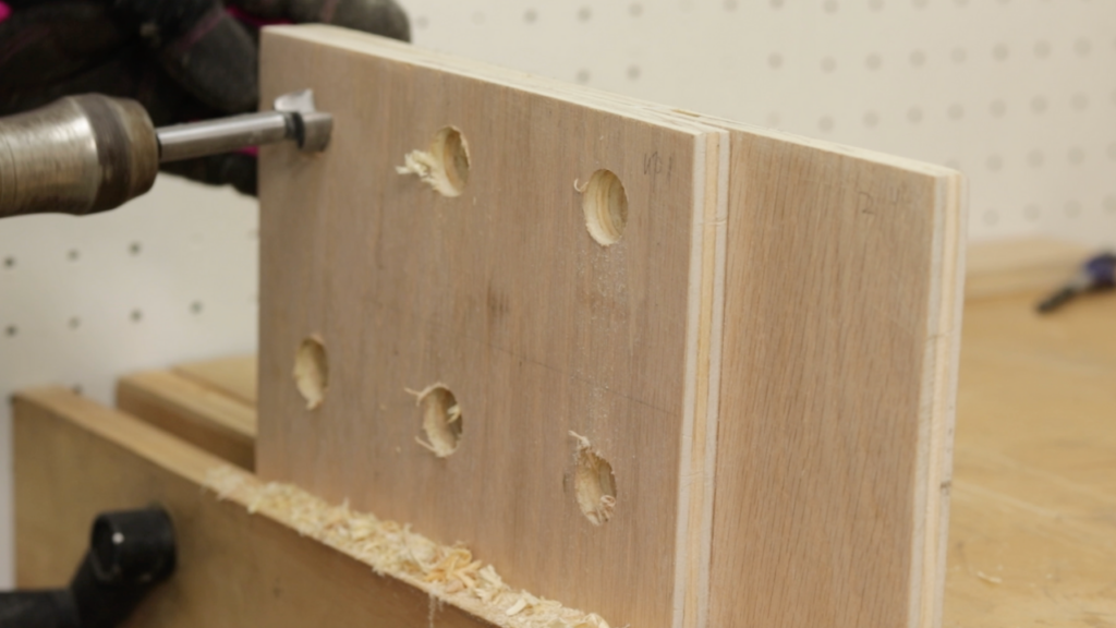 Start over from the other side and align the hole by utilize the small center hole left by the auger bit before, Hand Tools On Plywood: Bore Holes With A Swing Brace